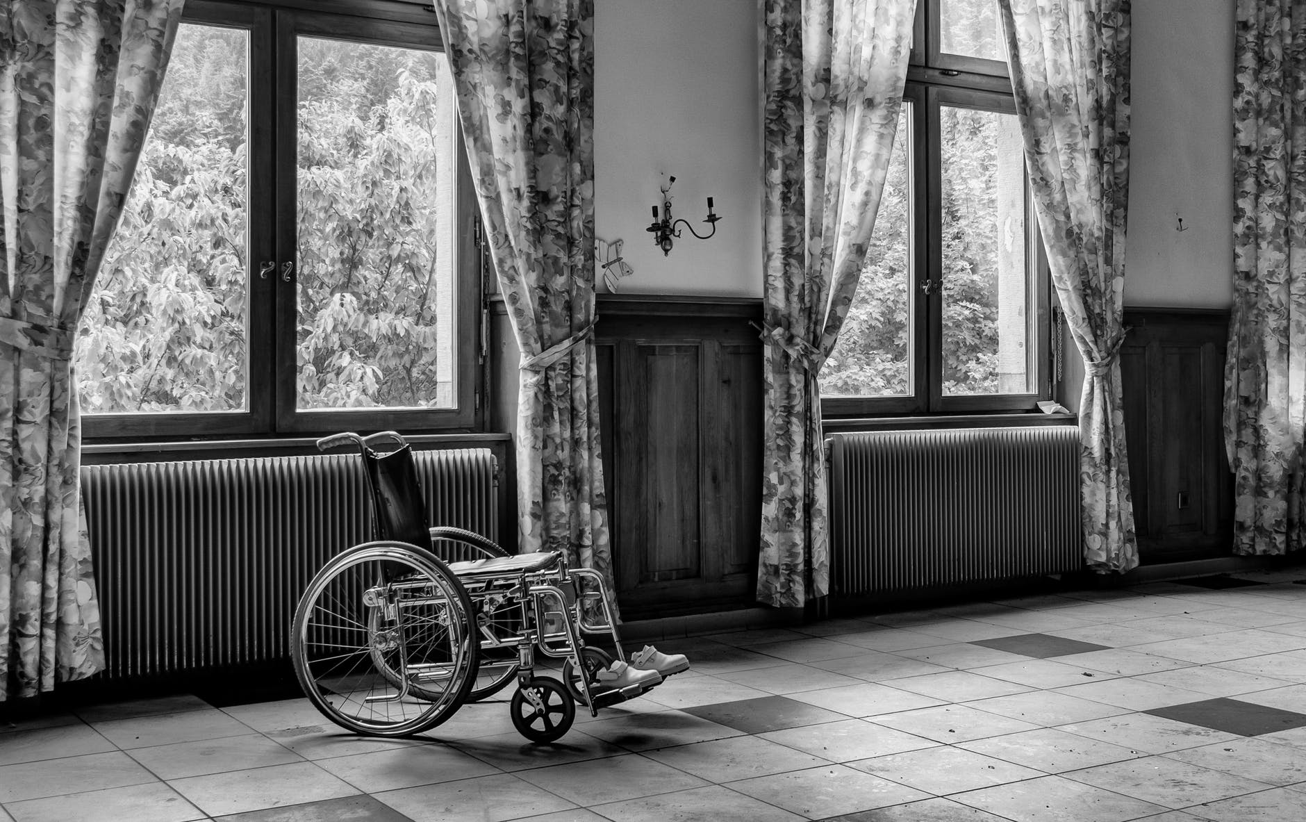 grayscale photo of wheelchair